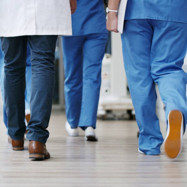 medical professionals walking away